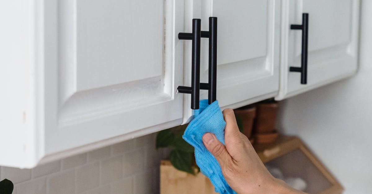 How do you clean kitchen cabinets without removing the finish?